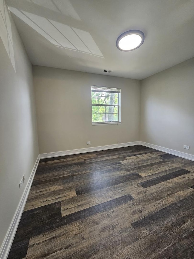 78 N Victoria Ln Unit F, Streamwood, IL 60107 - spare room with dark wood-type flooring and baseboards