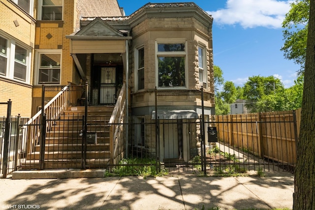 1831 S Avers Ave, Chicago, IL 60623 - doorway to property featuring stone siding and a gate