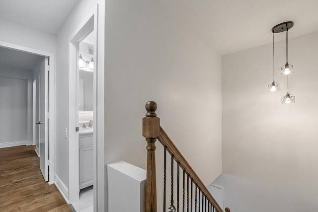 1115 S Plymouth Ct Unit 102, Chicago, IL 60605 - hallway with an upstairs landing, light wood-style floors, baseboards, and a sink