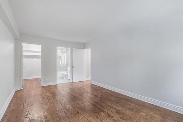1115 S Plymouth Ct Unit 102, Chicago, IL 60605 - empty room with wood finished floors and baseboards