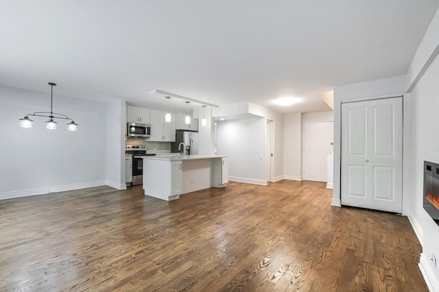 1115 S Plymouth Ct Unit 102, Chicago, IL 60605 - unfurnished living room featuring dark wood-type flooring, a sink, and baseboards