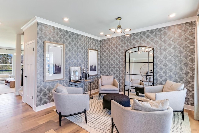23211 W Teton Ln, Plainfield, IL 60585 - living area with crown molding, light wood-style floors, a chandelier, baseboards, and wallpapered walls