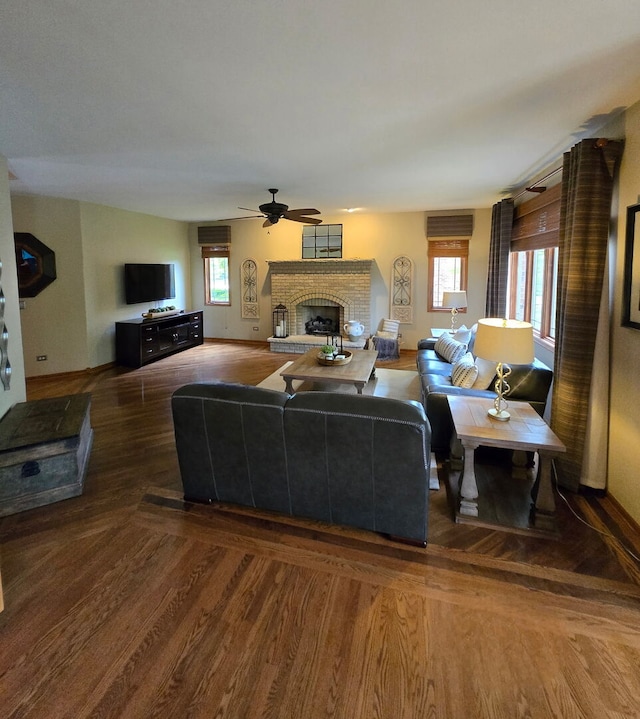 10880 Swallow Tail Ln, Frankfort, IL 60423 - living area featuring a brick fireplace, a ceiling fan, wood finished floors, and baseboards