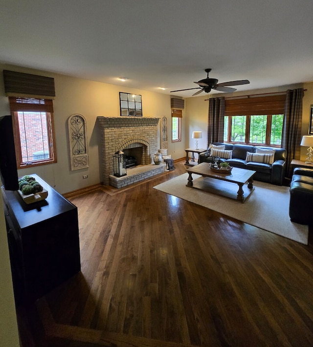 10880 Swallow Tail Ln, Frankfort, IL 60423 - living area featuring wood finished floors, ceiling fan, a brick fireplace, and baseboards