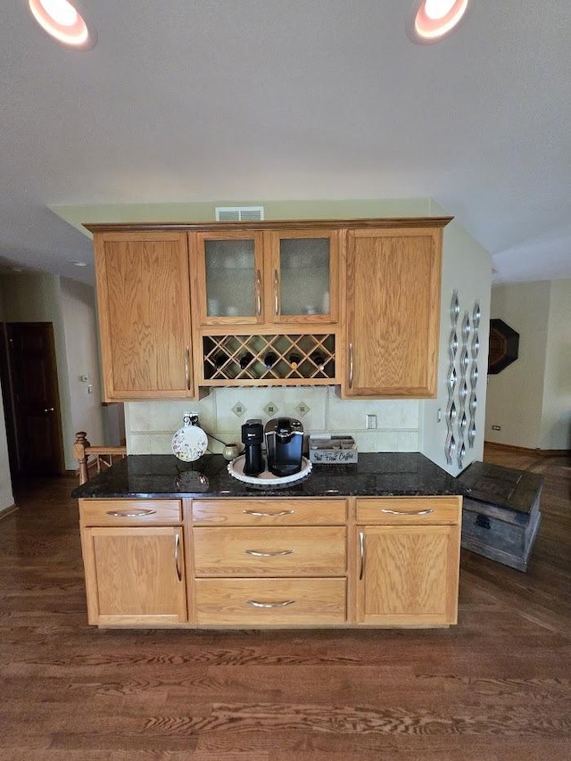 10880 Swallow Tail Ln, Frankfort, IL 60423 - kitchen featuring dark wood finished floors, glass insert cabinets, and dark stone counters