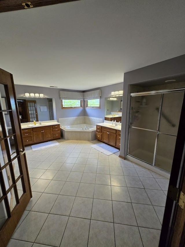 10880 Swallow Tail Ln, Frankfort, IL 60423 - bathroom with two vanities, a bath, tile patterned flooring, and a shower stall