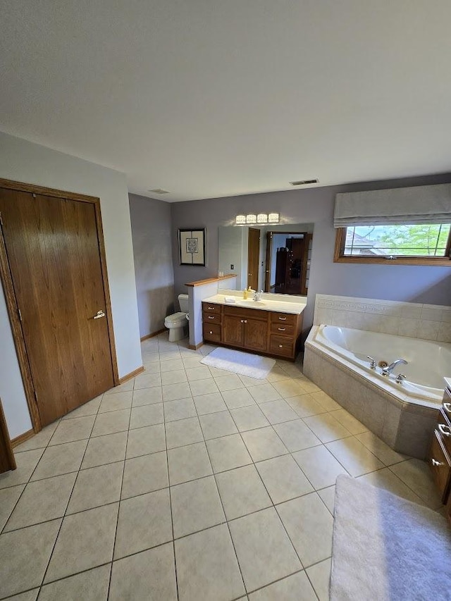 10880 Swallow Tail Ln, Frankfort, IL 60423 - full bathroom featuring vanity, a bath, tile patterned flooring, and toilet