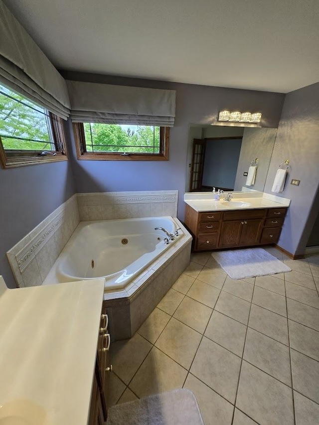 10880 Swallow Tail Ln, Frankfort, IL 60423 - bathroom with vanity, a tub with jets, and tile patterned floors