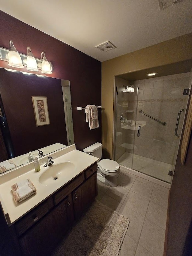 10880 Swallow Tail Ln, Frankfort, IL 60423 - bathroom featuring toilet, vanity, a shower stall, and tile patterned flooring