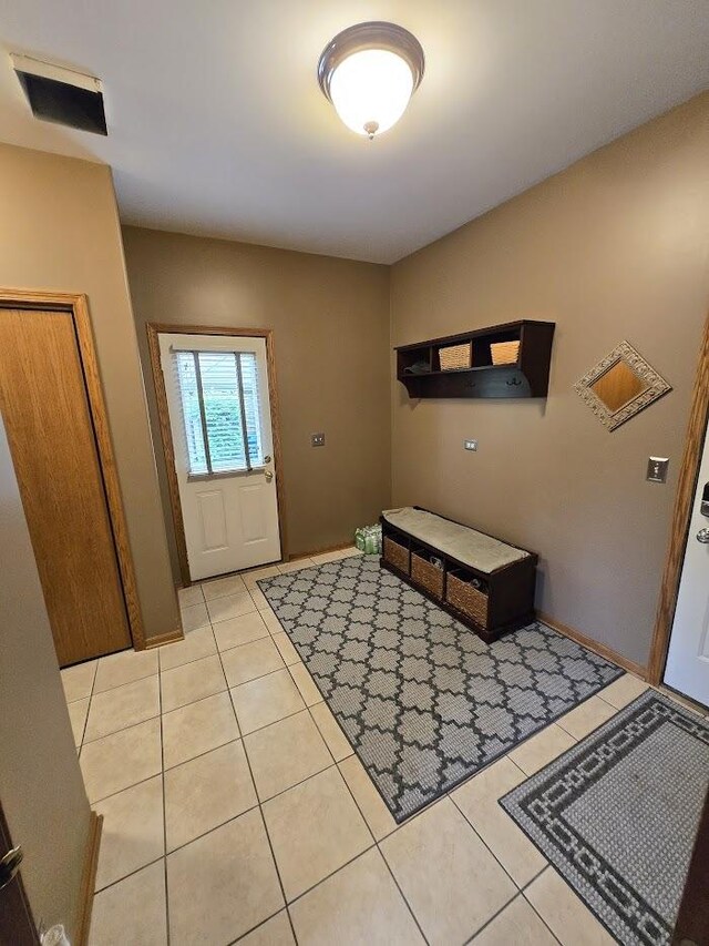 10880 Swallow Tail Ln, Frankfort, IL 60423 - foyer entrance featuring light tile patterned floors and baseboards