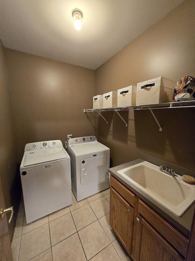 10880 Swallow Tail Ln, Frankfort, IL 60423 - laundry area featuring washing machine and clothes dryer, light tile patterned flooring, and cabinet space