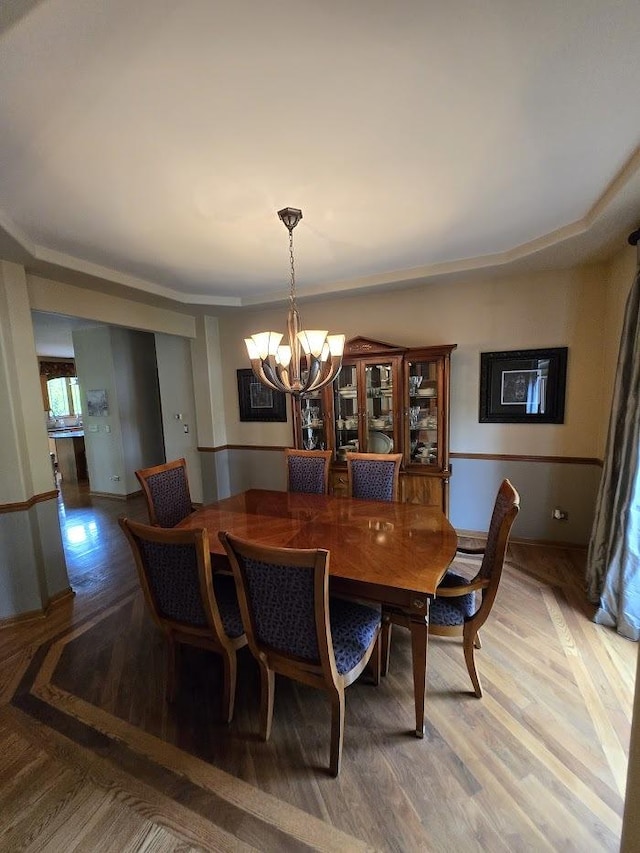 10880 Swallow Tail Ln, Frankfort, IL 60423 - dining space with a chandelier and light wood-type flooring