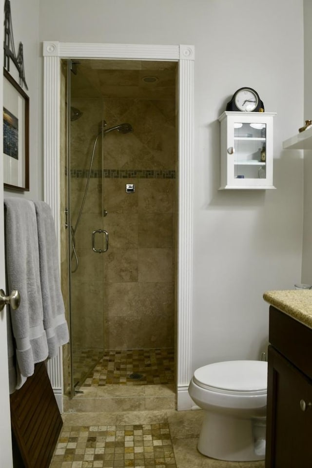 5206 N Winthrop Ave Unit 1, Chicago, IL 60640 - full bathroom featuring vanity, toilet, and a shower stall
