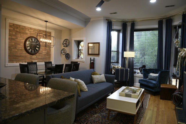 5206 N Winthrop Ave Unit 1, Chicago, IL 60640 - living area featuring ornamental molding, wood finished floors, a chandelier, and recessed lighting