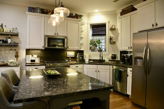 5206 N Winthrop Ave Unit 1, Chicago, IL 60640 - kitchen with open shelves, appliances with stainless steel finishes, ornamental molding, a sink, and decorative backsplash