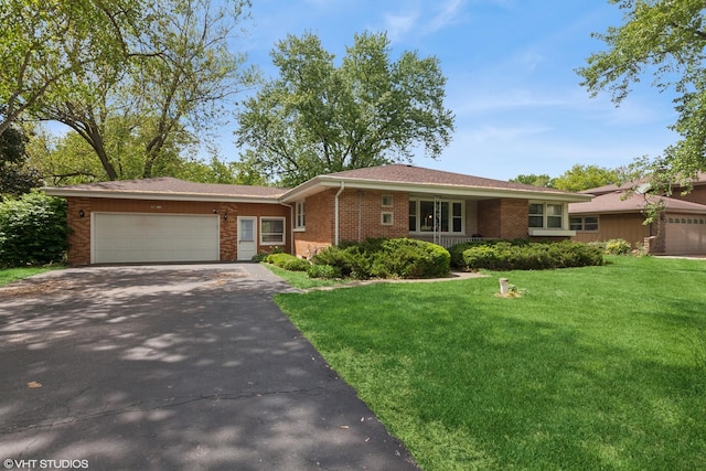 4N312 Kenwood Ave, West Chicago, IL 60185 - single story home featuring driveway, a front lawn, an attached garage, and brick siding