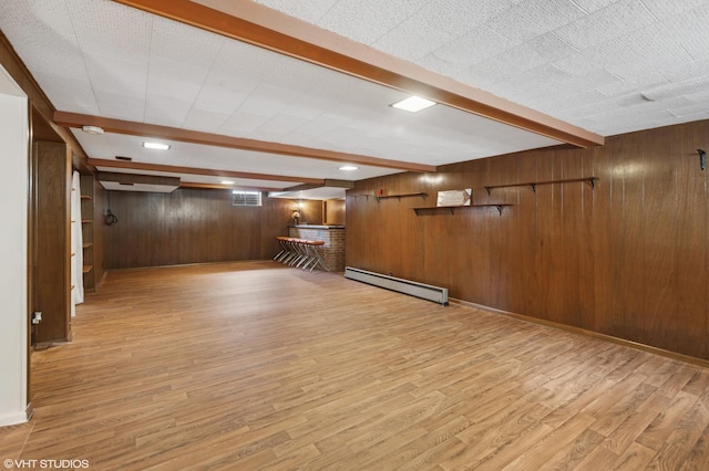 4N312 Kenwood Ave, West Chicago, IL 60185 - finished basement featuring a baseboard heating unit, wooden walls, and light wood-style floors