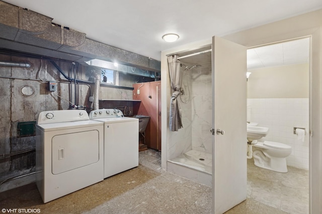 4N312 Kenwood Ave, West Chicago, IL 60185 - laundry room featuring tile walls and washing machine and clothes dryer