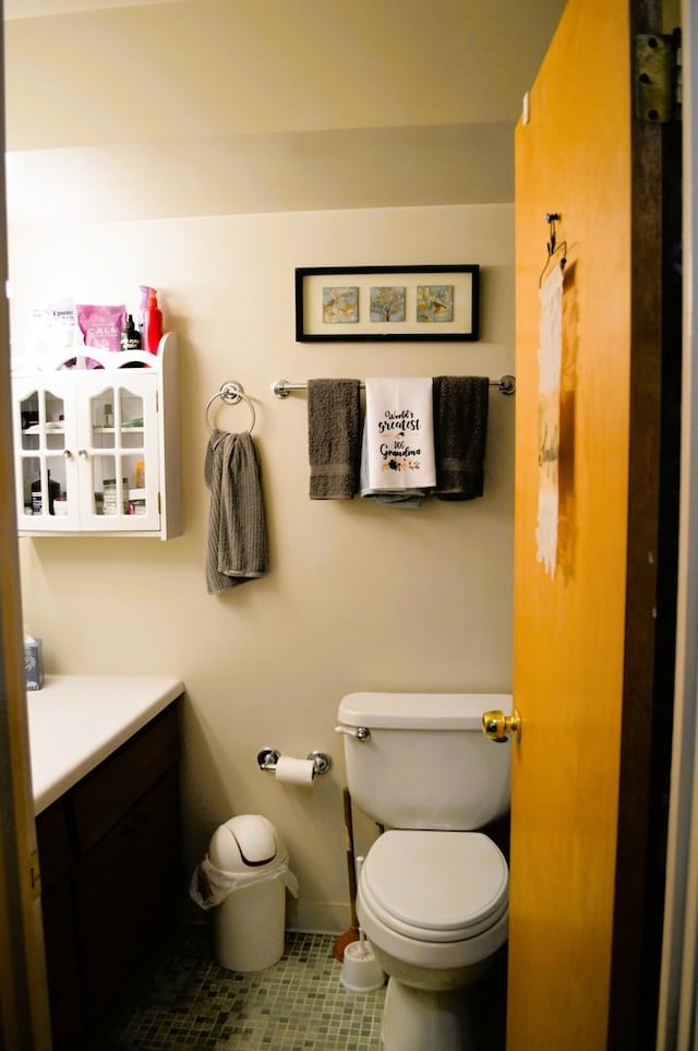 9820 S Pulaski Ave Unit 218, Oak Lawn, IL 60453 - half bath featuring toilet, tile patterned flooring, vanity, and baseboards