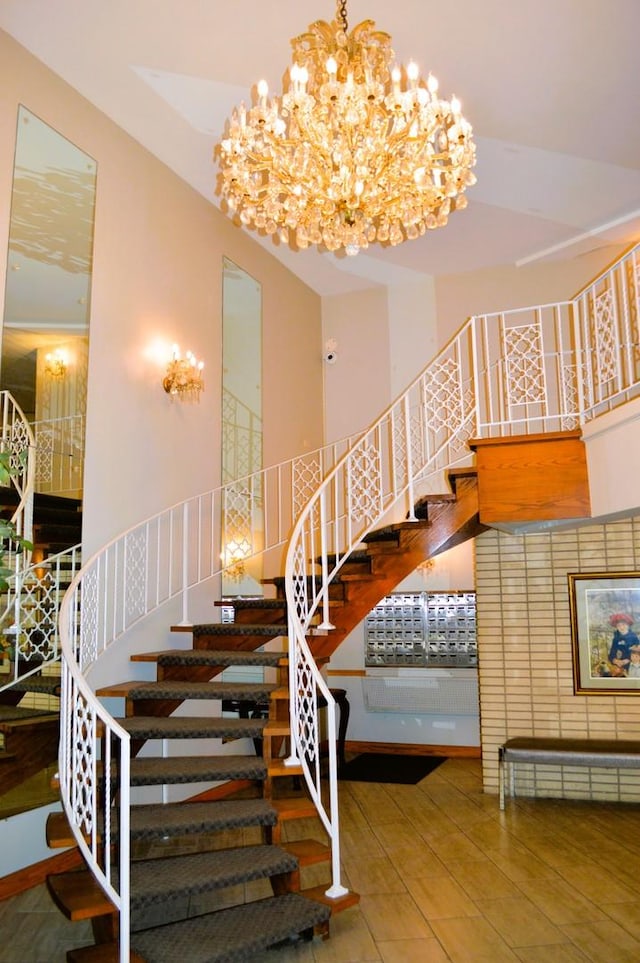 9820 S Pulaski Ave Unit 218, Oak Lawn, IL 60453 - stairway with a chandelier, wood finished floors, and a towering ceiling