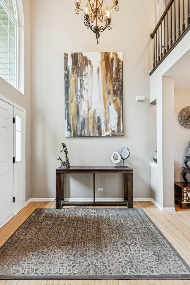 900 Legacy Rdg, Algonquin, IL 60102 - entryway featuring a towering ceiling, wood finished floors, a chandelier, and plenty of natural light