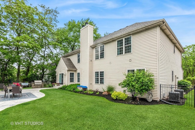 900 Legacy Rdg, Algonquin, IL 60102 - back of property featuring a chimney, a patio, and a shingled roof