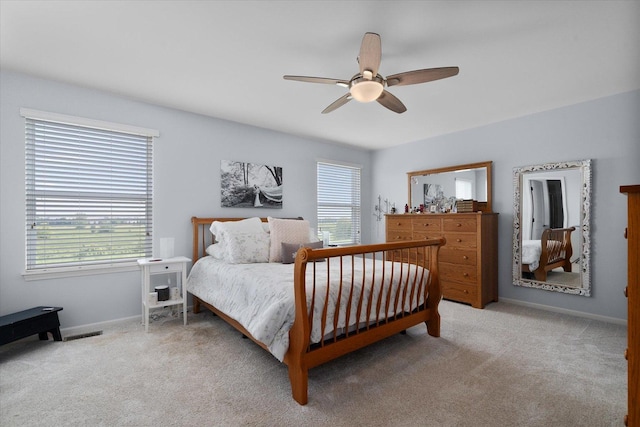 1552 Hearthstone Ln, North Aurora, IL 60542 - bedroom with multiple windows, light carpet, and ceiling fan