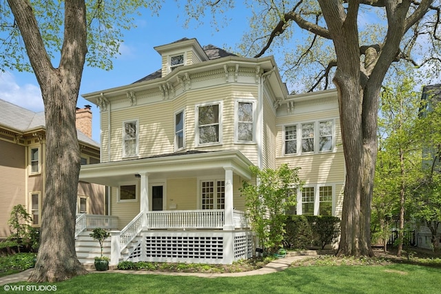 739 Forest Ave, Evanston, IL 60202 - italianate-style house featuring a porch, stairway, and a front yard