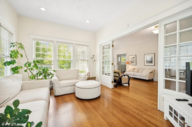 739 Forest Ave, Evanston, IL 60202 - living area with wood finished floors, recessed lighting, and a textured ceiling