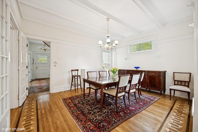739 Forest Ave, Evanston, IL 60202 - dining room with a chandelier, wood finished floors, beam ceiling, and baseboards