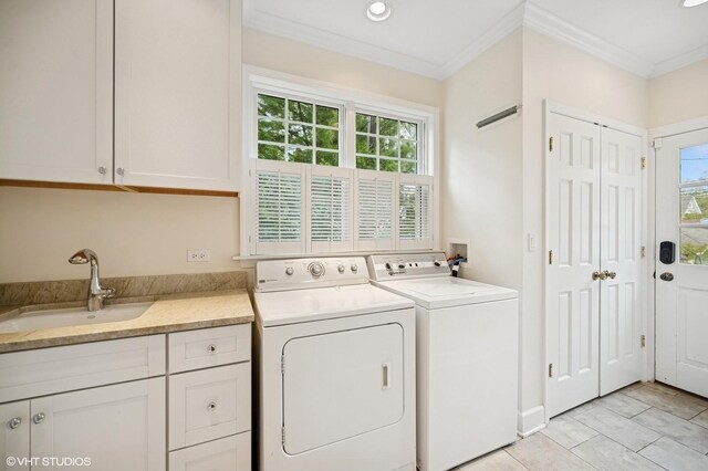 739 Forest Ave, Evanston, IL 60202 - washroom with cabinet space, ornamental molding, washing machine and dryer, recessed lighting, and light tile patterned floors