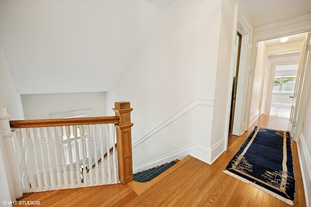 739 Forest Ave, Evanston, IL 60202 - corridor with an upstairs landing, wood finished floors, and baseboards