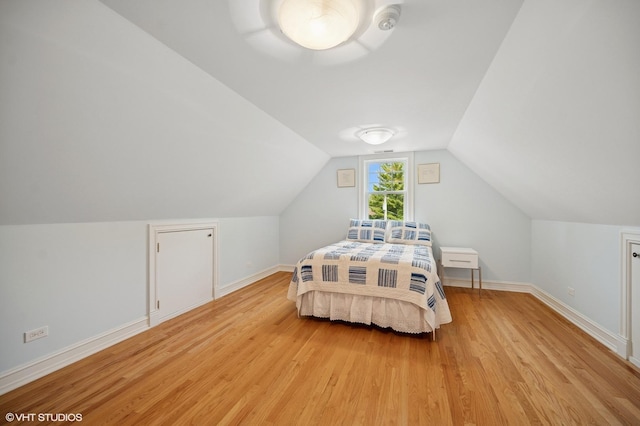 739 Forest Ave, Evanston, IL 60202 - bedroom with light wood-style flooring, lofted ceiling, and baseboards