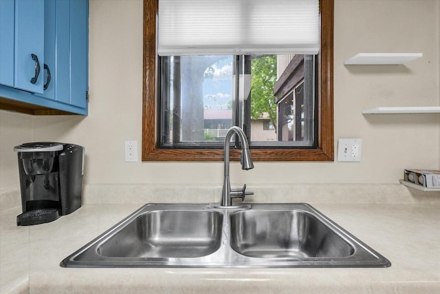 1803 Oliver Dr Unit 3, Urbana, IL 61802 - kitchen with a sink, blue cabinetry, and light countertops