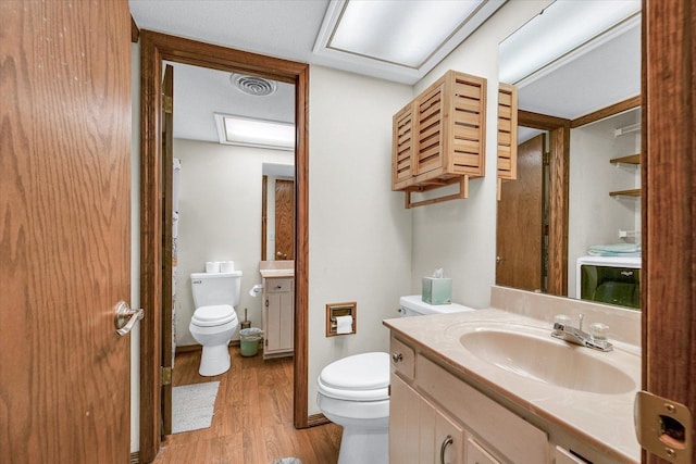 1803 Oliver Dr Unit 3, Urbana, IL 61802 - bathroom featuring toilet, wood finished floors, and vanity