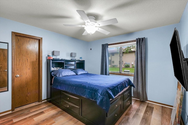 1803 Oliver Dr Unit 3, Urbana, IL 61802 - bedroom with wood finished floors, ceiling fan, and baseboards