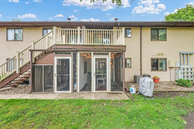 1803 Oliver Dr Unit 3, Urbana, IL 61802 - rear view of house featuring a sunroom, stairs, a yard, and cooling unit