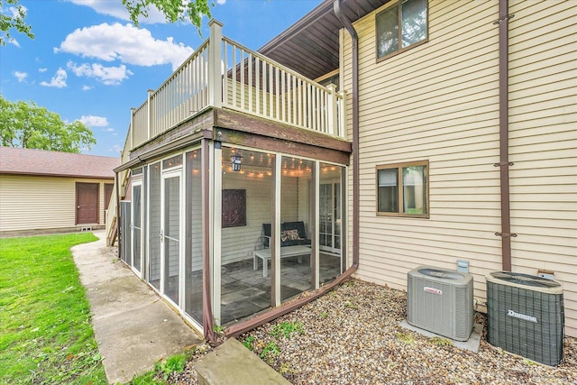 1803 Oliver Dr Unit 3, Urbana, IL 61802 - rear view of property featuring central AC and a sunroom