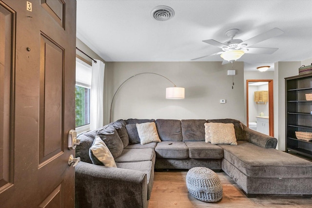 1803 Oliver Dr Unit 3, Urbana, IL 61802 - living area with light wood-style flooring, ceiling fan, and built in features