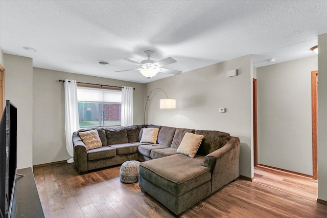 1803 Oliver Dr Unit 3, Urbana, IL 61802 - living room with wood finished floors, ceiling fan, a textured ceiling, and baseboards