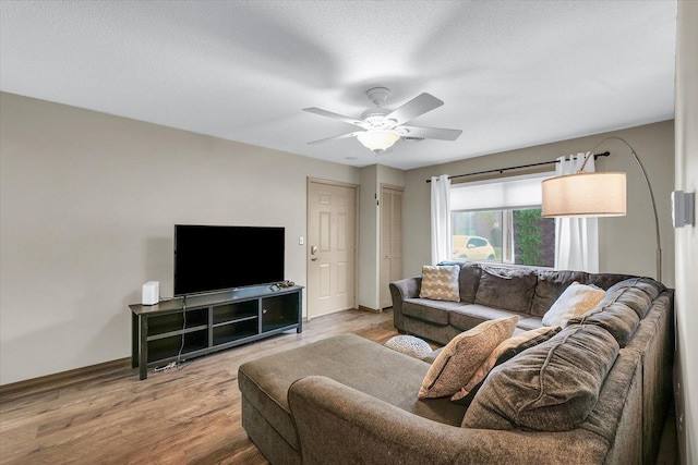 1803 Oliver Dr Unit 3, Urbana, IL 61802 - living room with baseboards, a ceiling fan, wood finished floors, and a textured ceiling