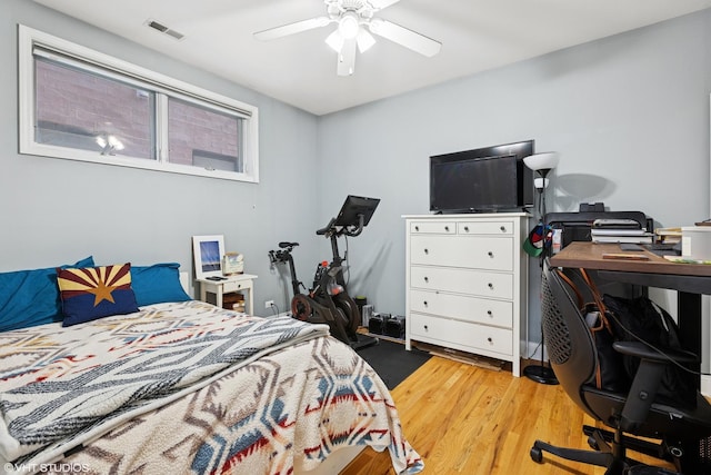 3717 N Wilton Ave Unit 1, Chicago, IL 60613 - bedroom with an office area, light wood finished floors, and a ceiling fan