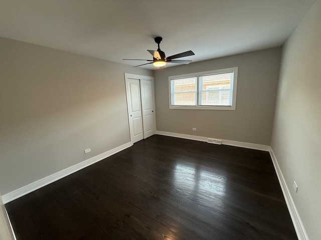 3906 W 117th St, Alsip, IL 60803 - spare room featuring a ceiling fan and dark wood-style floors