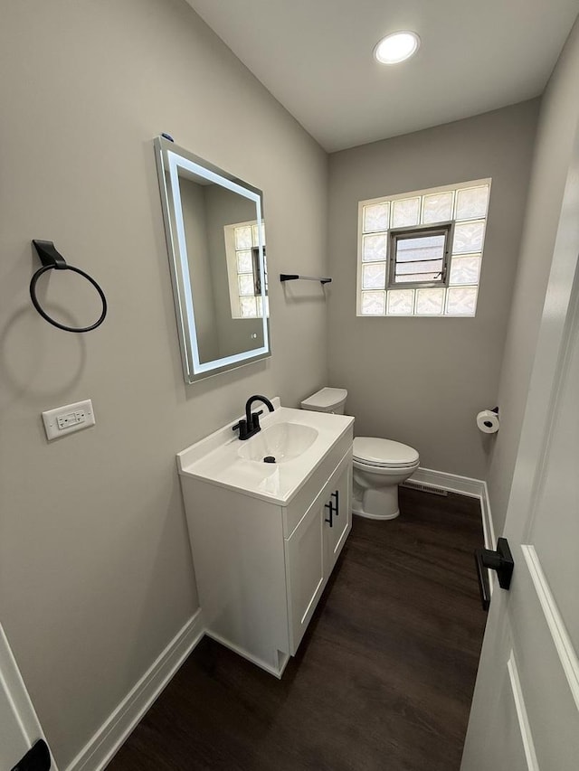 3906 W 117th St, Alsip, IL 60803 - bathroom featuring wood finished floors, vanity, and recessed lighting