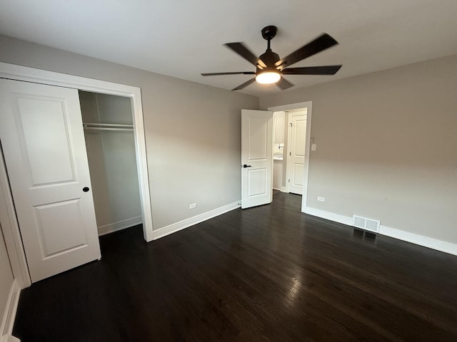 3906 W 117th St, Alsip, IL 60803 - unfurnished bedroom featuring dark wood-style floors, a closet, and a ceiling fan
