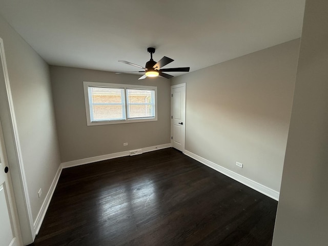 3906 W 117th St, Alsip, IL 60803 - unfurnished room featuring dark wood-style flooring and a ceiling fan