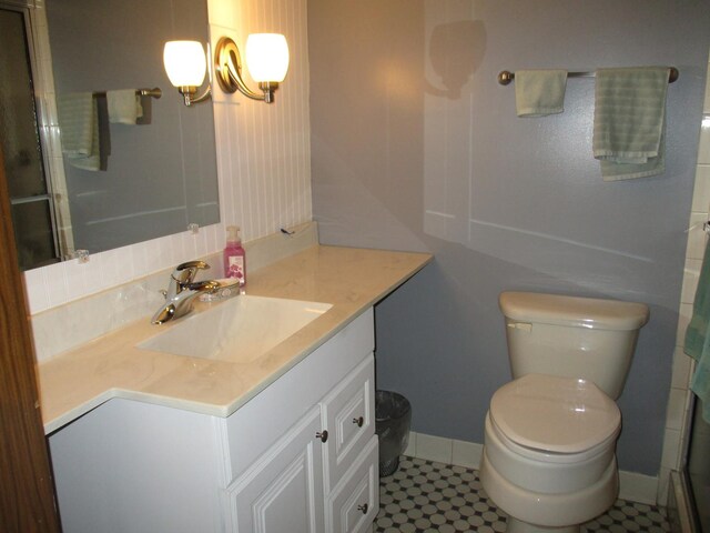402 Heritage Ln, Ottawa, IL 61350 - bathroom featuring vanity, toilet, baseboards, a shower with door, and a chandelier