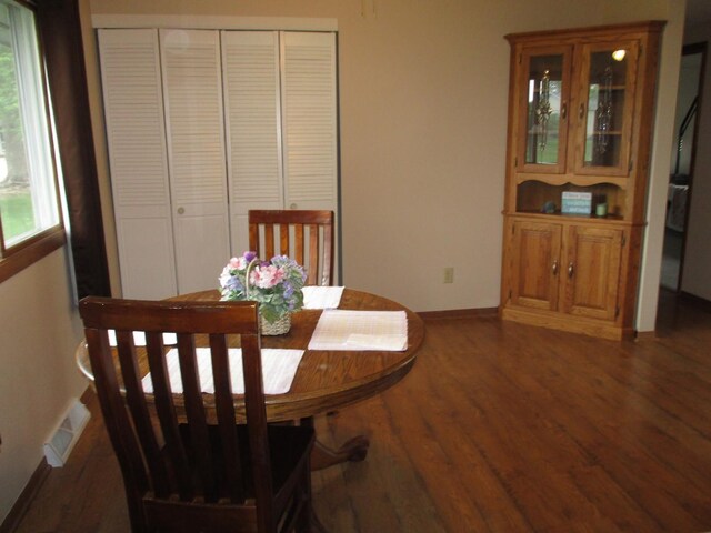 402 Heritage Ln, Ottawa, IL 61350 - dining room featuring wood finished floors, plenty of natural light, and baseboards