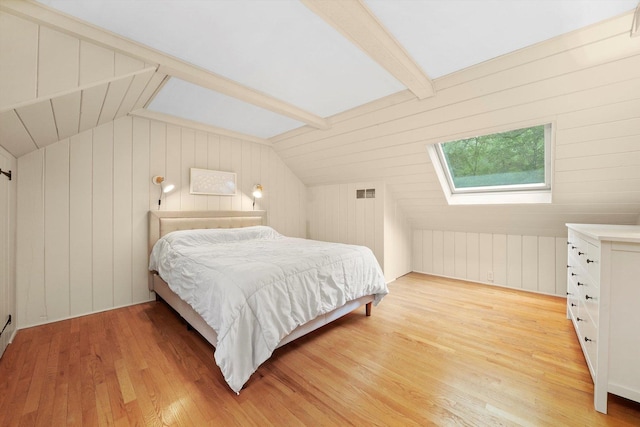 4N307 Knoll Creek Dr, Saint Charles, IL 60175 - bedroom featuring vaulted ceiling, light wood-type flooring, a skylight, and wood walls