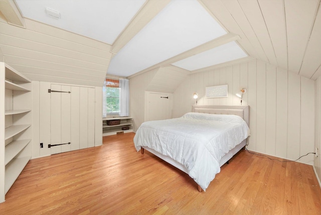 4N307 Knoll Creek Dr, Saint Charles, IL 60175 - bedroom featuring vaulted ceiling, light wood-style flooring, and wood walls